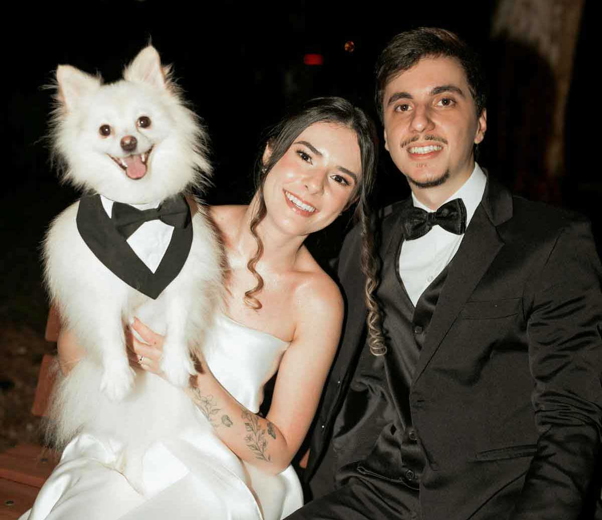 bride and groom man and dog wearing matching tuxedos