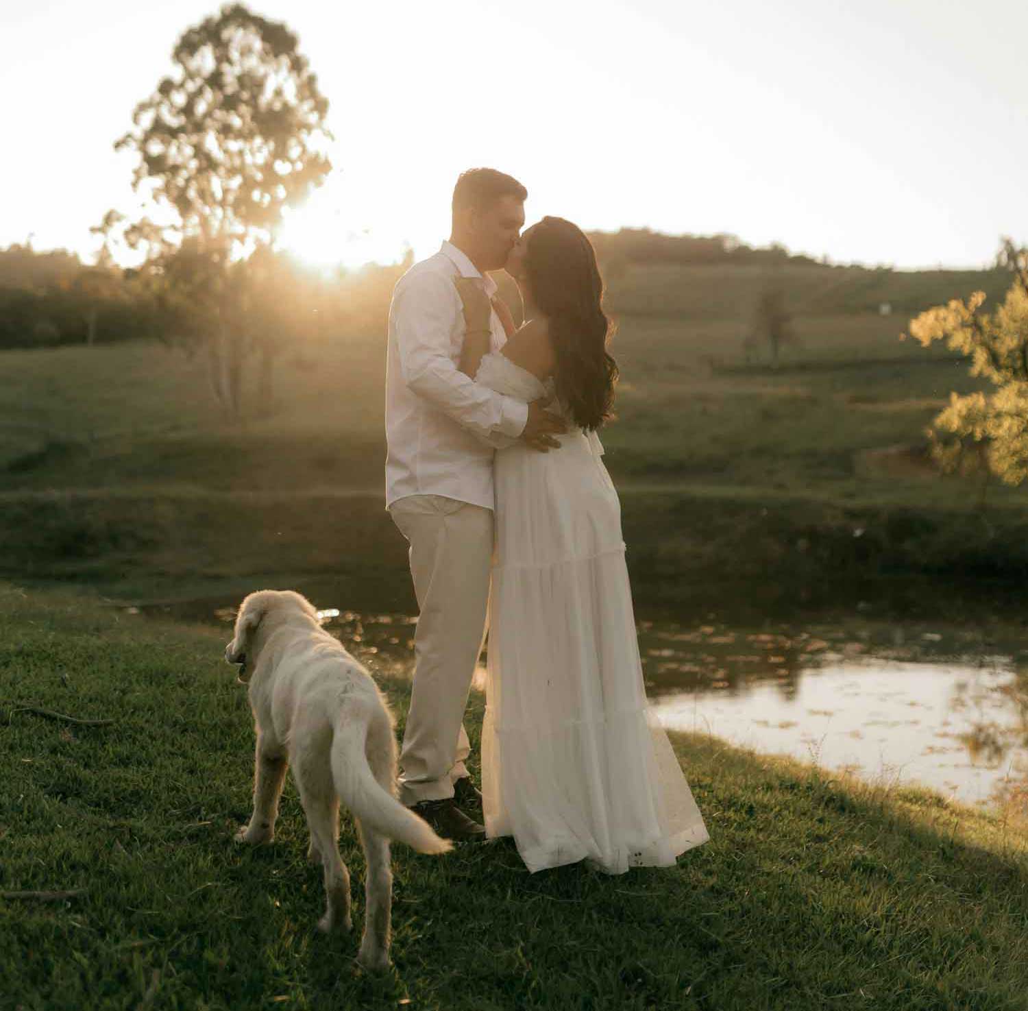 engagement photos at sunset couple with their dog