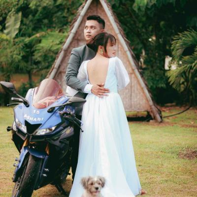 Bride and groom with motorbike and dog